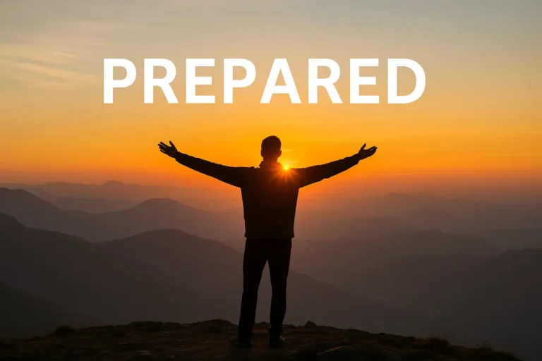 A confident individual standing on a mountaintop at sunrise, symbolizing the power of being prepared for success